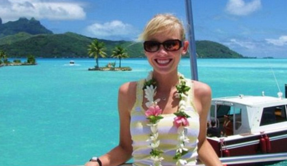 Sherry Papino standing in front of a boat