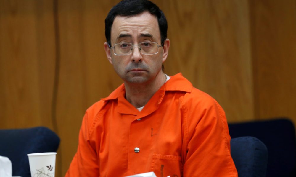 Larry Nassar, a former team USA Gymnastics doctor who pleaded guilty to sexual assault, listens to victims impact statements during his sentencing in the Eaton County Circuit Court in Charlotte