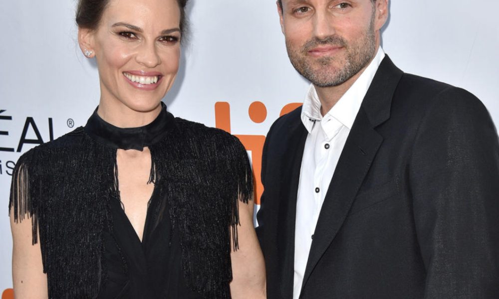 Philip Schneider and Hilary Swank.