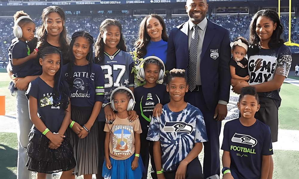 Shaun Alexander and his wife Valerie Alexander with their children