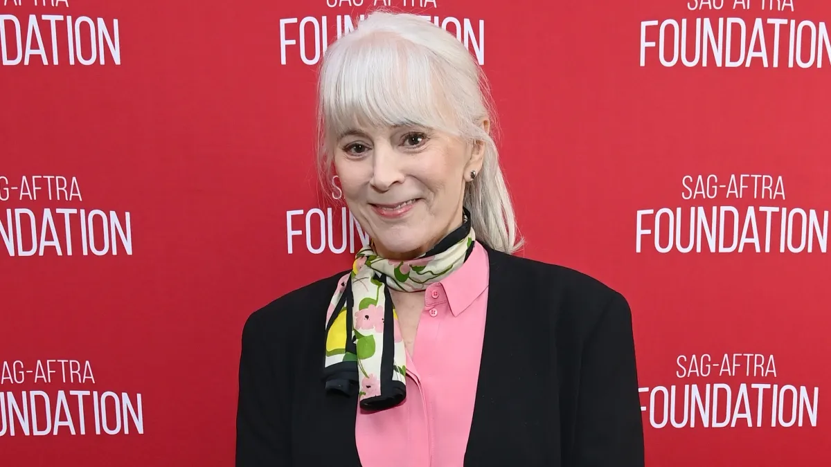 Patricia Richardson smiling and posing on the red carpet