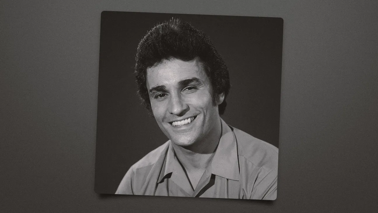 Black-and-white portrait of actor Michael DeLano, showing him in his early career with a confident expression and classic mid-century Hollywood styling.