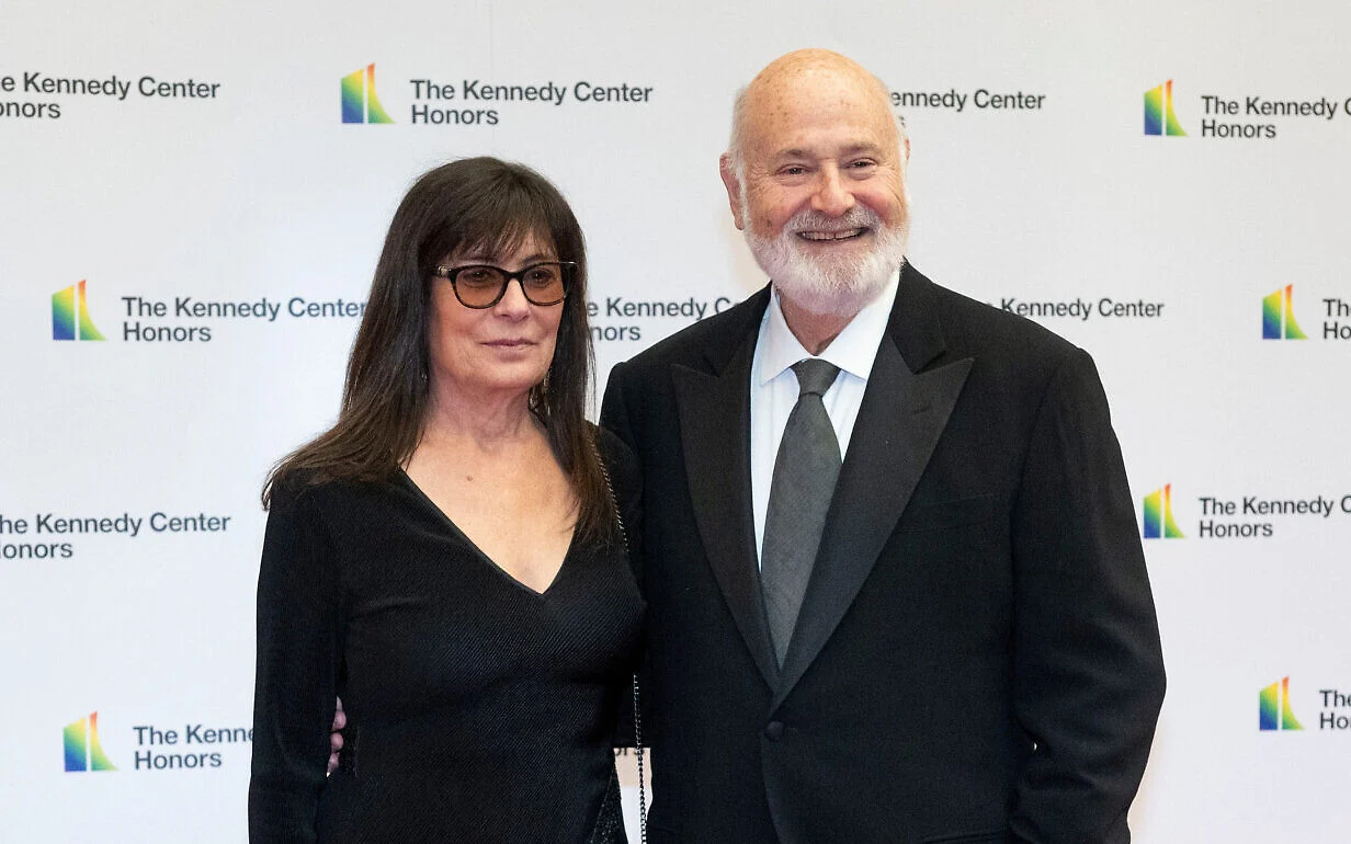 Rob Reiner and his wife Michele Singer Reiner pose together on the red carpet at a Hollywood premiere