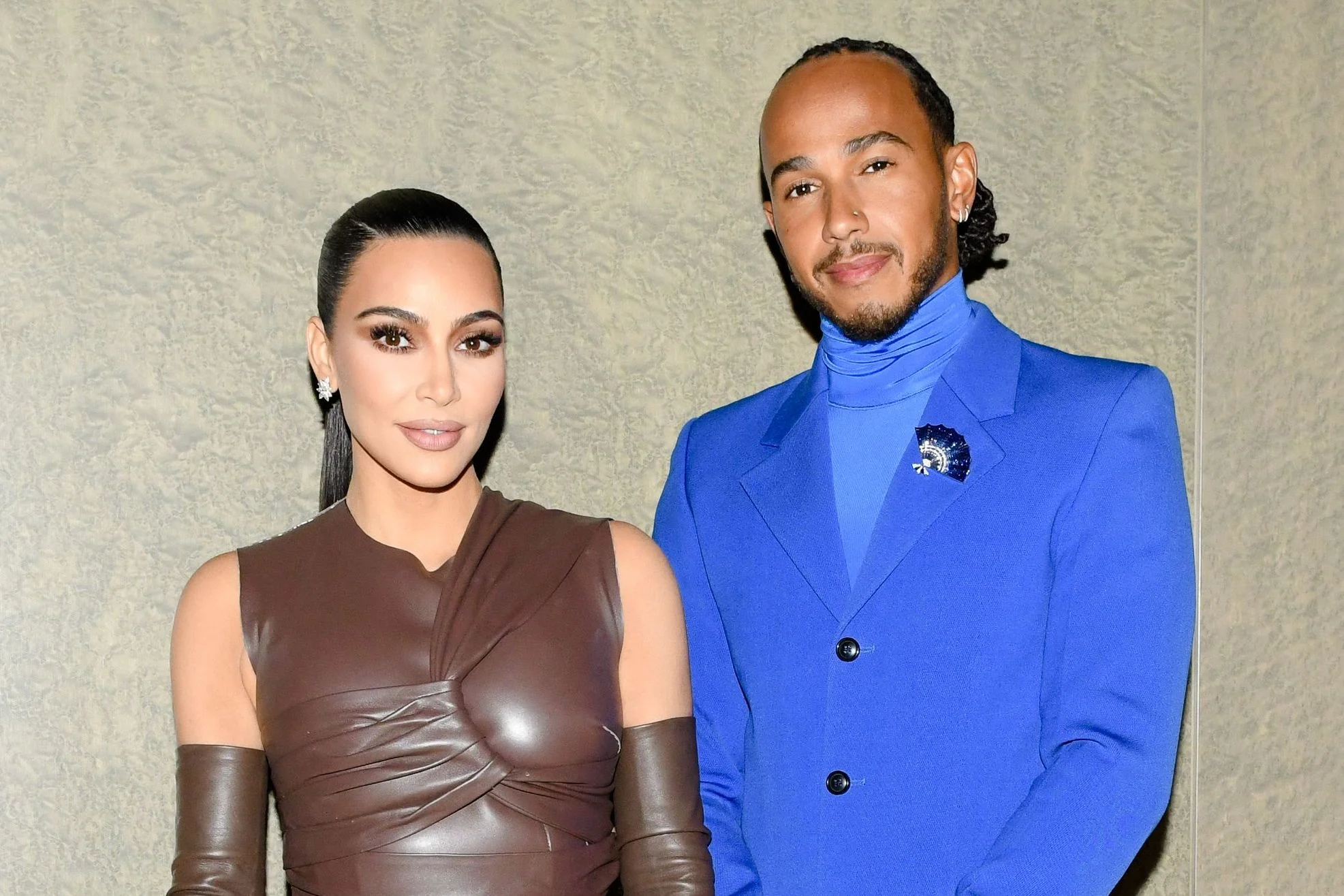 Kim Kardashian and Lewis Hamilton pose together during a night out, showcasing their budding romance and high-profile celebrity src.