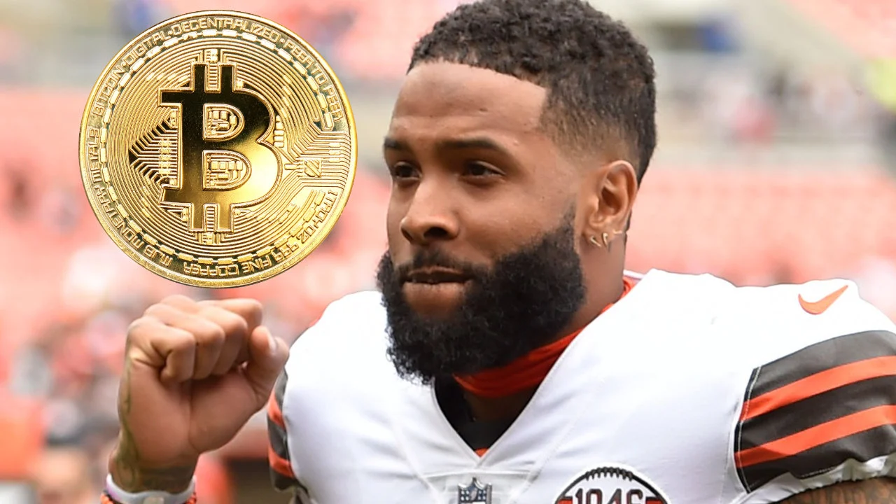 Odell Beckham Jr. running on the football field with a glowing Bitcoin icon hovering above him, symbolizing his high-profile cryptocurrency investment.