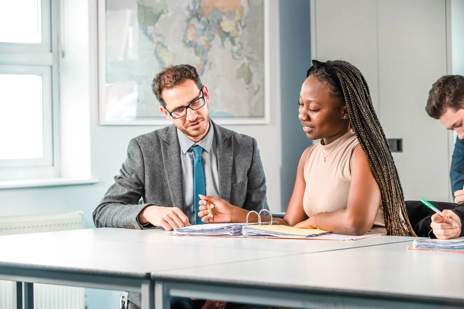 School finance administrator using accounting software to manage invoices and reports