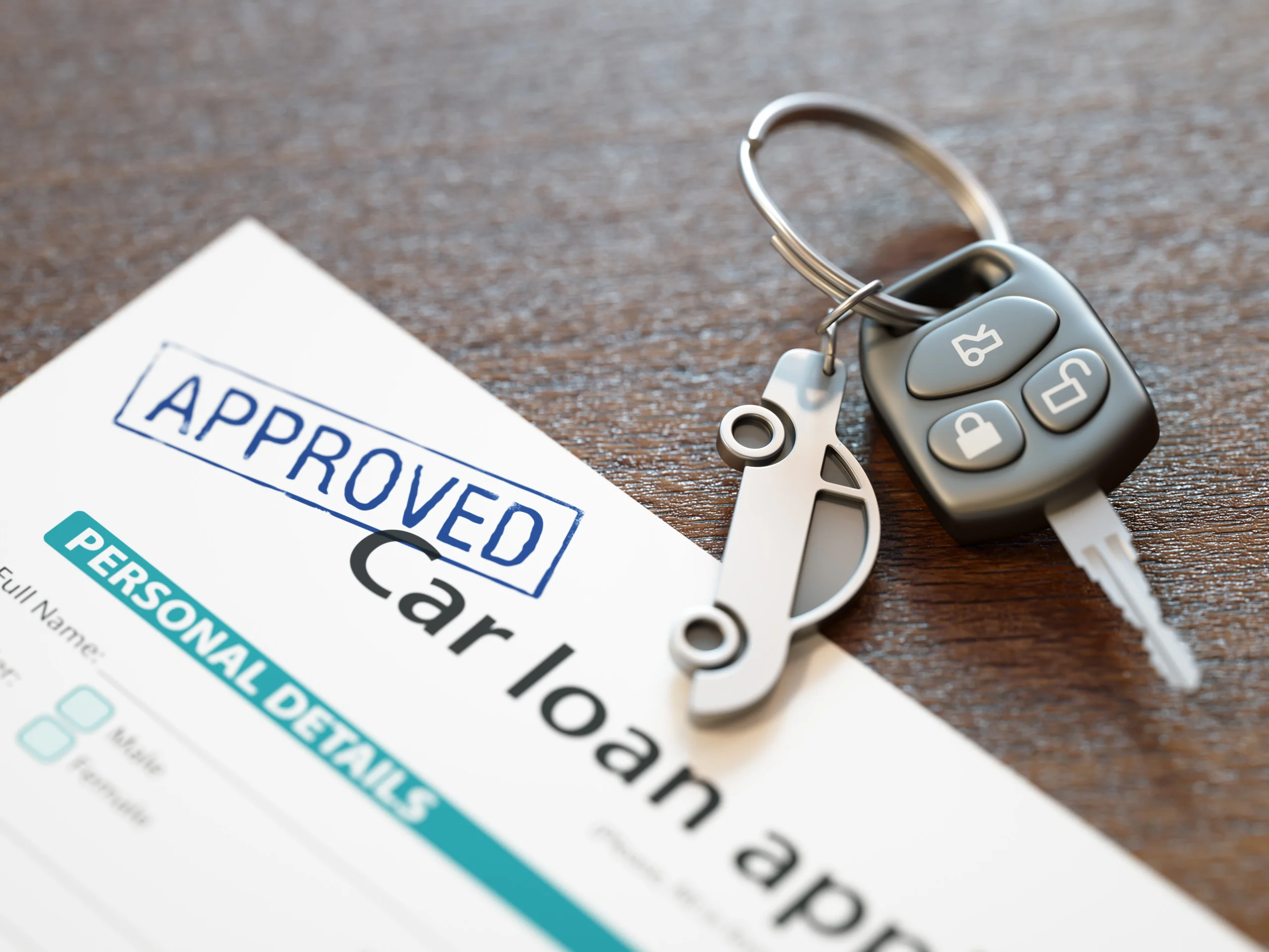 Car keys and loan paperwork representing a car title loan application