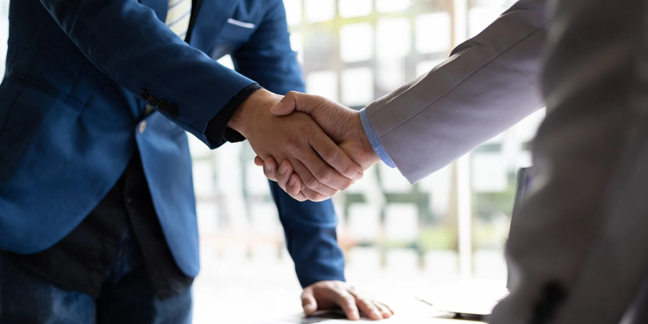 business partner handshake after the meeting. financial and investment cooperation.
