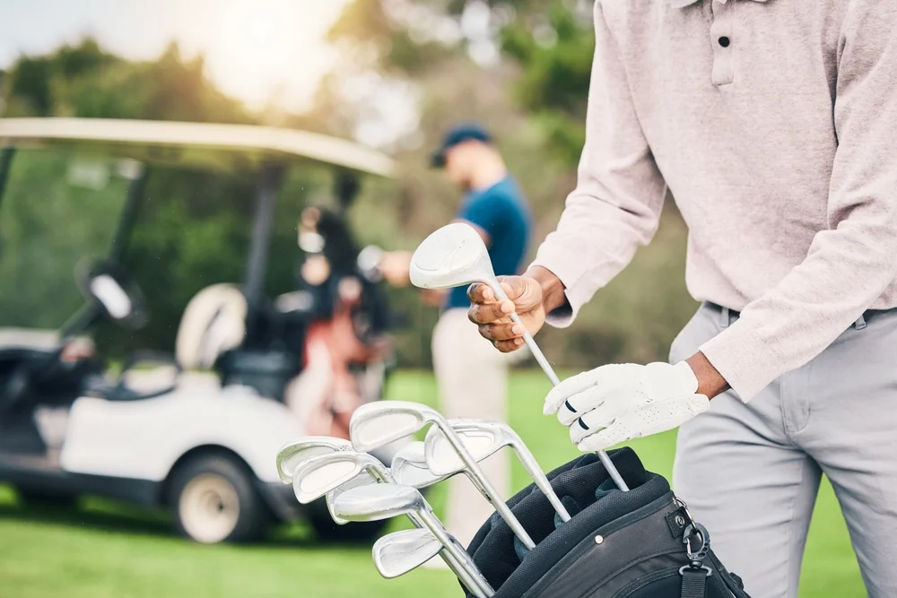 golf,,choose,club,and,hands,of,man,with,golfing,bag