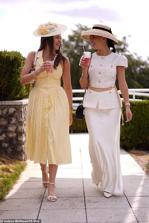 Ready for the racing action! Racegoers arrive for day one of the Qatar Goodwood Festival at Goodwood Racecourse, Chichester