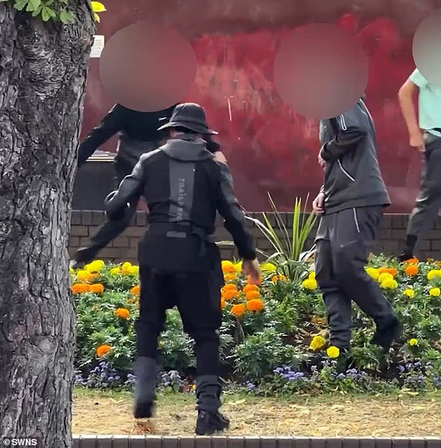 Onlookers watched in disgust as a group of youths destroyed a flowerbed in Sutton Coldfield, Birmingham