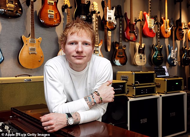 Ed Sheeran (pictured in Los Angeles in November 2025) wants to convert six historic barns at his £1.1million farm dating back to the 17th century into storage space for a 'music archive'