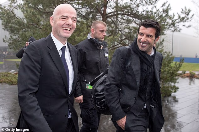 Portugal legend Luis Figo (right) pictured with under pressure FIFA president Gianni Infantino