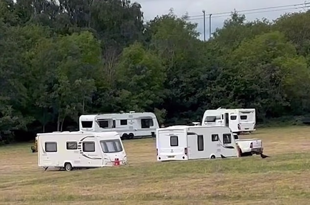 Dozens of travellers forced their way into Highfield Lane recreational park in Quinton, south Birmingham, on Monday afternoon