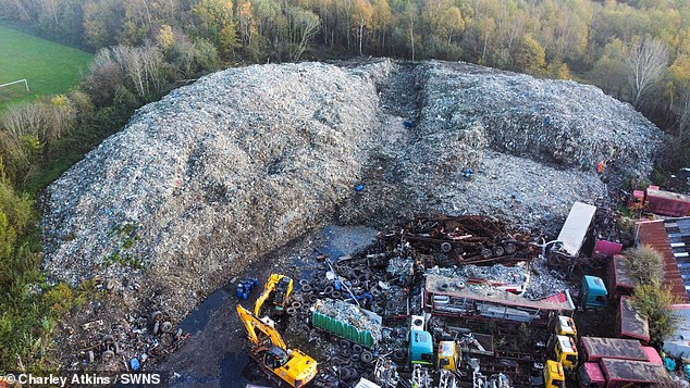 Four men have been arrested over an 'atrocious' 25,000-ton illegal waste dump in Wigan