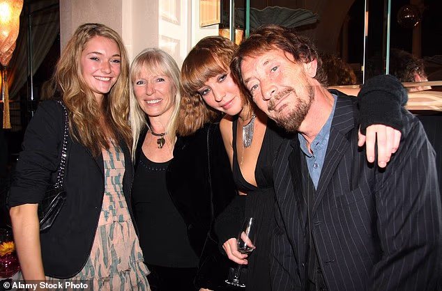 Driving Home For Christmas singer Chris Rea has reportedly left £12million to his wife Joan as his will is revealed (pictured with Joan and their daughters Josie (R) and Julia (L) in 2009)