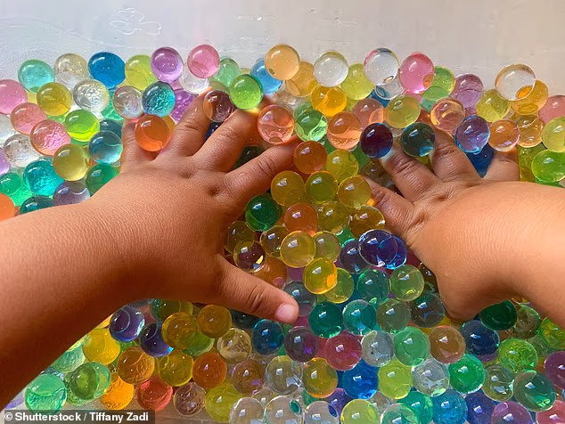 They might look innocent, but water beads can have fatal consequences if ingested (stock image)