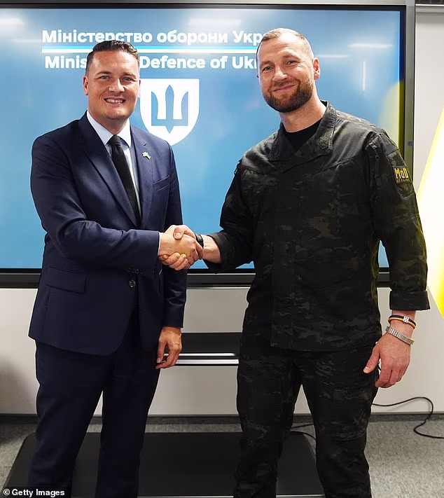 British Defence Secretary Wes Streeting shakes hands with acting Minister of Defence of Ukraine, Yevhenii Khmara, during his visit to the Ukrainian capital on Wednesday