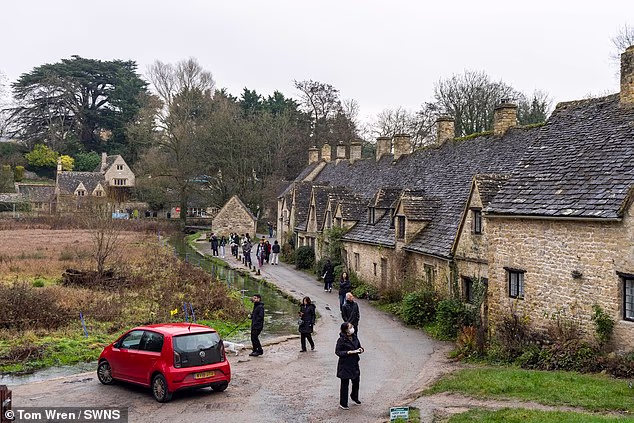 Bibury is famous for its 14th-century honey-colored stone cottages once featured on the inside cover of British passports. Tourists can be seen here flocking to the area