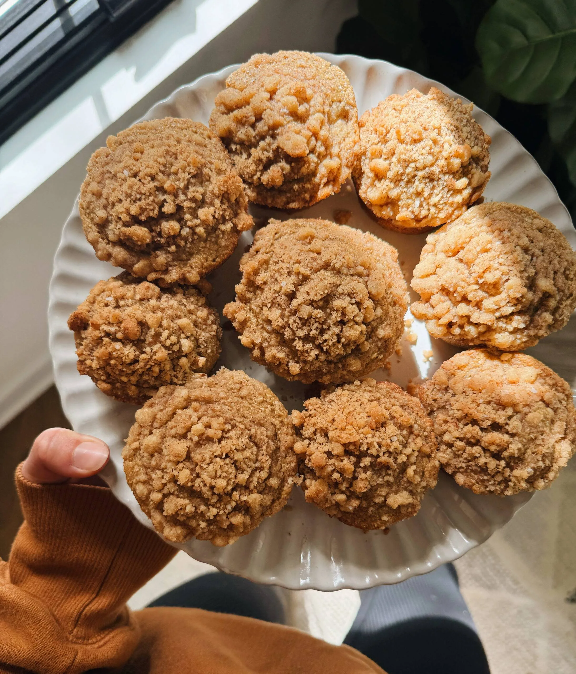 Apple streusel muffins on a plate.