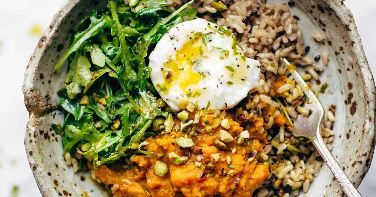 Healing Bowls with Turmeric Sweet Potatoes, Poached Eggs, and Lemon Dressing Recipe